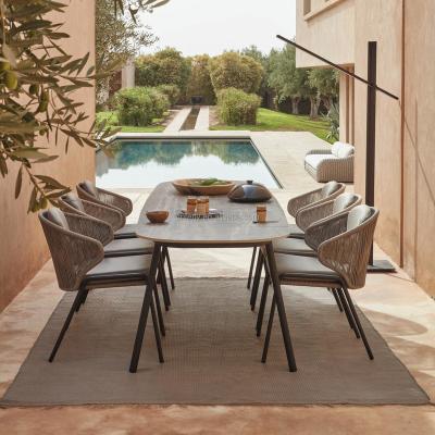 China Contemporary All Weather Luxury Outdoor Rope Woven Dining Table and Chairs Modern Design Furniture Garden Dining Set for sale