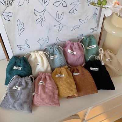 China Eco-friendly LOGO custom color drawstring corduroy small portable dust jewelry bag for home storage for sale