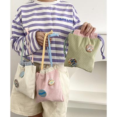 China Eco-friendly Custom Color Mini Cordury Macaron Drawstring Bag With Customized Tag for sale