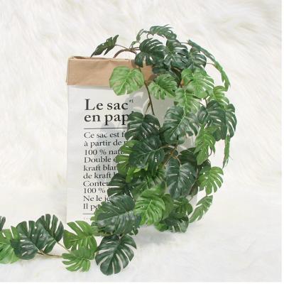 China fabric & Plastic Garland Wedding Party Decoration Real Touch Home Greenery Plastic Artificial Plants Leaves Monstera Vine Festival for sale