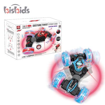 China 2021 1:28 Drift Stunt Car Drift Control Remoto Car Remoto 1:28 Drift Control New Design Radio Electric Gesture Hand Toys Double Sided Stunt Car Toys for sale