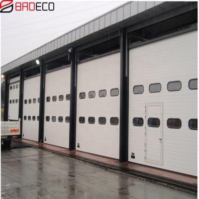 China Windproof Automatic Industrial Door Sectional Overhead Industrial Door With Stained Glass for sale