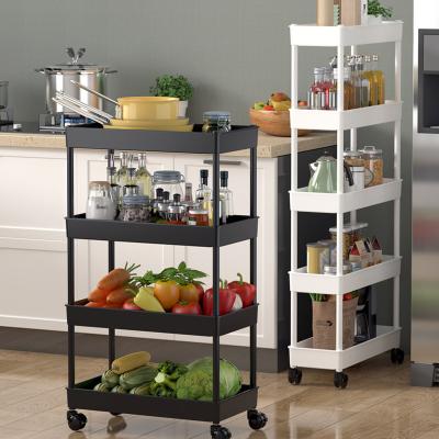 China Traditional Multi-layer kitchen floor rotating fruit vegetable basket shelf swivel storage organizer rack cart with wheels for sale