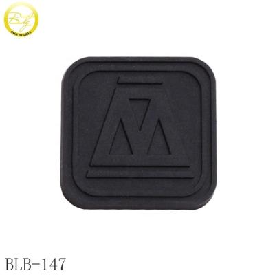 China Viable custom embossed soft rubber badge small black logo silicone rubber patch shoes for garment for sale