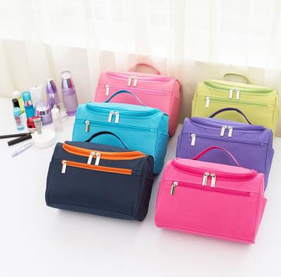 China Multifunctional Portable Fashion Polyester Toiletry Bag Hot Pink Travel Toiletry Makeup Hanging Bag for sale