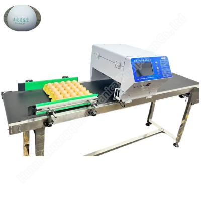 China Máquina de estampado de huevos de 220v 50hz Máquina de codificación de huevos de inyección de tinta 50000 huevos/h en venta