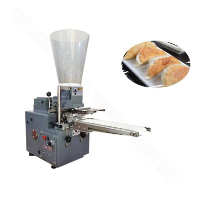 China Máquina de fazer Gyoza frita de mesa Máquina de reboque de samosa 1500 pcs/h à venda