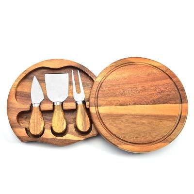 China Viable Customize New Product Professional Acacia Wood Round Cheese Board With Knife And Fork Set for sale