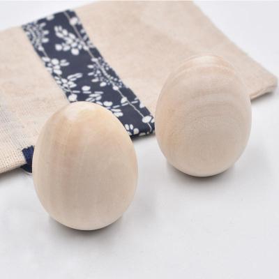 China 100% 2023 New Hot Sale Cheap Eco-friendly Unfinished Wooden Easter Eggs for Painting Child Toy Wooden Craft Eggs and Display Ready to Paint Decoration for sale