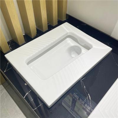 China Modern Glossy White Pan Washdown Public Toilet Squatting Ceramic WC Factory Supply WC Ceramic Squat Toilet for sale