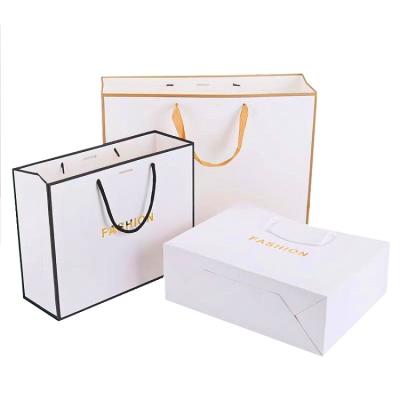 China Wholesale Luxury Price 28*20*10cm/32*25*11cm Art Paper Shopping Bag With Environmental Protection Factory Hot Sale Logo for sale