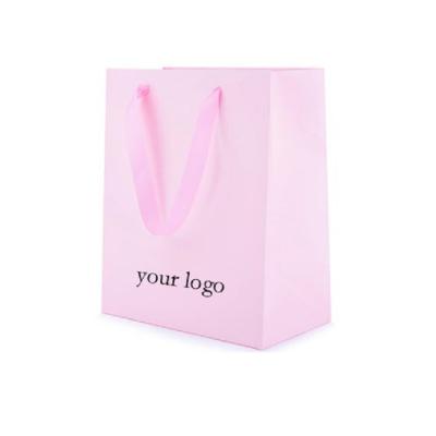 China Wholesale Recyclable Recycled Materials Logo Printed Pink Shopping Gift Custom Paper Bag With Handle for sale