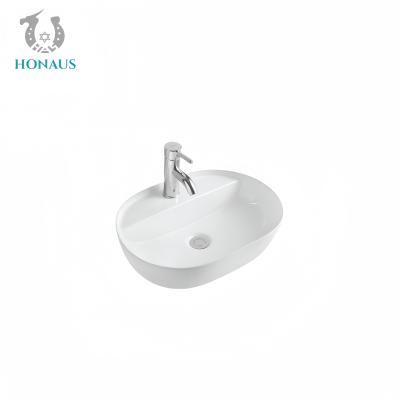 Chine Elegant salle de bain ovale Table bassin 1280 degrés Céramique brûlé inclus 135mm à vendre