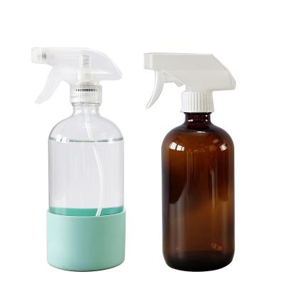 China HomeCare 500ml 16oz Clear Boston Round Trigger Spray Glass Bottle With Colorful Silicone Sleeve for sale