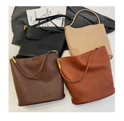 China Fashion Textured Autumn Large Capacity Shoulder Underarm Feminine Bags Solid Color Women Handbags High Quality PU Leather Handbags for sale