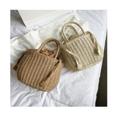 China Fashion 2021 Summer Handbag Woven Beach Hand Shoulder Drawstring Basket Bag New Vacation Women Travel Rope Paper Bag Straw Fashion for sale