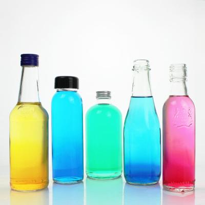 China Eco-freindly Round Shape Chinese Wholesale Cheap Price Portable Beverage 250ml 375ml Glass Juice Bottle for sale