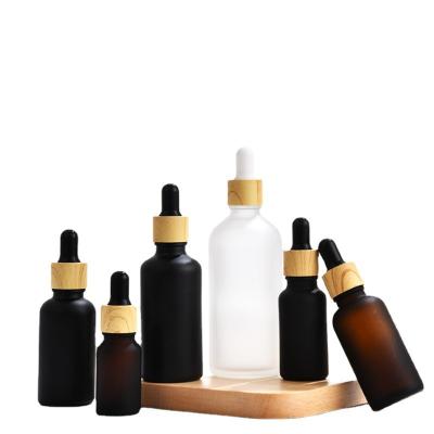 China 5ml 10ml 15ml 20ml 30ml 50ml 100ml Amber Clear White Black Glass Round Dropper Bottle Essential Oil Cosmetic Bottle for sale