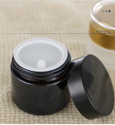 China 2021 Skin Care Body Cream Cosmetic Packaging 15g 30g 50g Matte Frosted Amber Black Glass Cream Jar With Black Metal Lid for sale