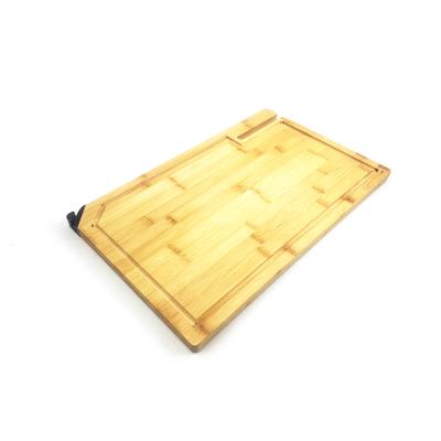 China Sustainable Sustainable Kitchen Butcher Block Bamboo Chopping Cutting Board With Froove For Cutting Meat And Vegetables for sale