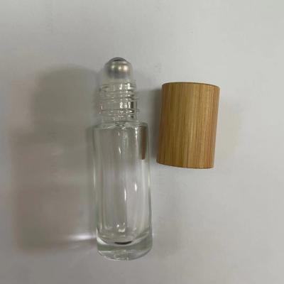 China Personal Care Good Quality 5ml Glass Bottle With Bamboo Cap For Perfume Oil for sale