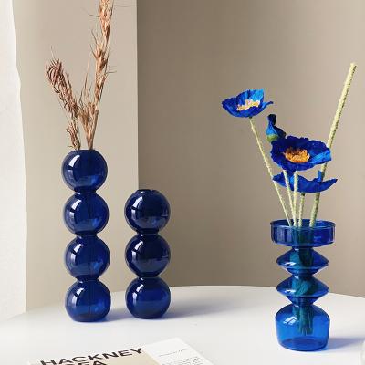 China Customized Modern Blue Cheap Transparent Glass Home Decoration Art Round Hand Blown Flower Vase Flower Arrangement Home Decors Size New Arrival for sale