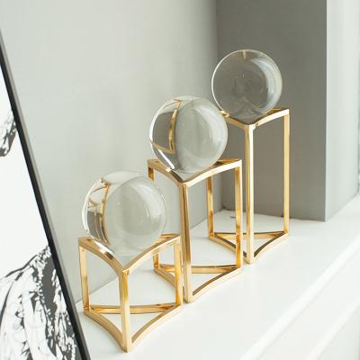 China Metal decorative creative table triangular bracket cylinder Europe home sculpture transparent crystal ball for hotel decoration for sale