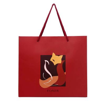 China Custom Handmade Luxury Fancy Paper Kraft Paper Shopping Bag With Ribbon Handle Custom Gold Shopping Gift Hot Stamping Retail Paper Bag for sale