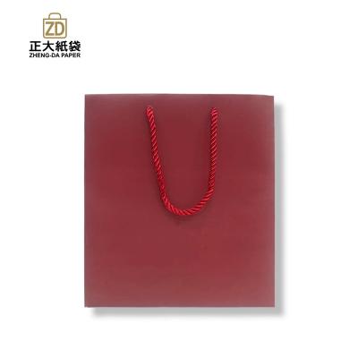 China Eco-friendly Coated Art Paper Gift Packaging With Braided Cotton Rope Handle for sale