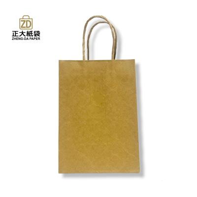 China Eco - Friendly Brown Kraft Paper Bags Wholesale With Twisted Paper Handle for sale