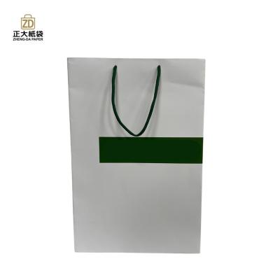 China Eco - Friendly Boutique Shopping Luxury Printed Paper Bags Wholesale for sale