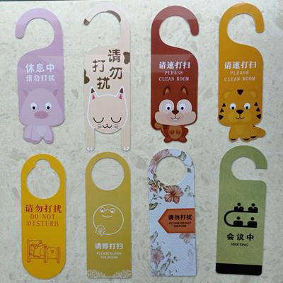 China paper & Cardboard Hotel Wholesale Door Cartoon Hangers Cheap Paper Hanger Card for sale