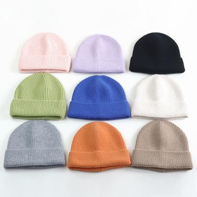 China COMMON Wholesale Multifunctional Acrylic Windproof Knitted Warm Hats Solid Color Winter Beanie Hats for sale