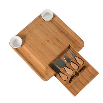 China Sustainable Natural Bamboo Cheese Board Set With Bonus Condiment Cup Charcuterie Cheese Board Knife Set Wooden Tray for sale