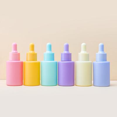 China 30ml Small Cosmetic Frosted Lotion Perfume Dropper Bottle Macaron Colored Cylindrical Glass Bottles for sale