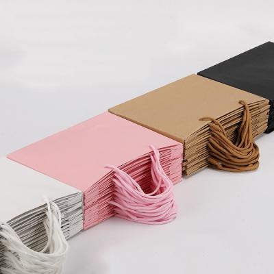 China Recyclable Wholesale Custom Printing Ribbon Handle Luxury Elegant Gift Shopping Logo Paper Bag for Clothing for sale