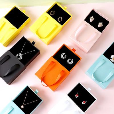 China Portable Necklace Ring Drawer Storage Box Bag Handmade Travel Earring Pull Out Jewelry Box With Handle for sale