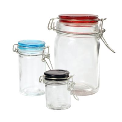 China Traditional Wholesale Empty Clear Glass Food Storage Jar With Lid for sale