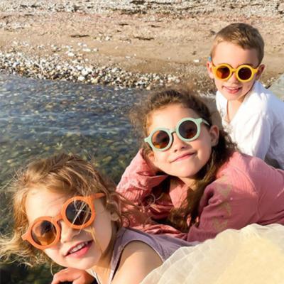 China New shading/deocoration trend children's sunglasses frosted frame UV400 glass baby boys and girls round sunglasses for sale