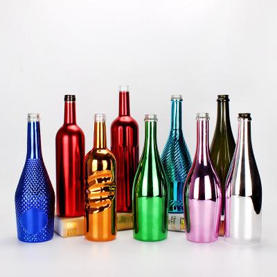 China Cheap 750ml drink plate heavy clear burgundy red wine bottles UV luxury empty champagne bottle heavy clear bottle glass with seal caps for sale