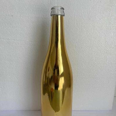 China Cheap luxury empty beverage gold 750ml green electroplate wine glass bottle for champagne burgundy wine bottles with custom for sale