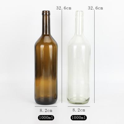 China Wholesale price 1000ml 32oz empty clear glass /factory high qiality juice beverage red wine brown glass bottles 1L with cork and shrink caps for sale