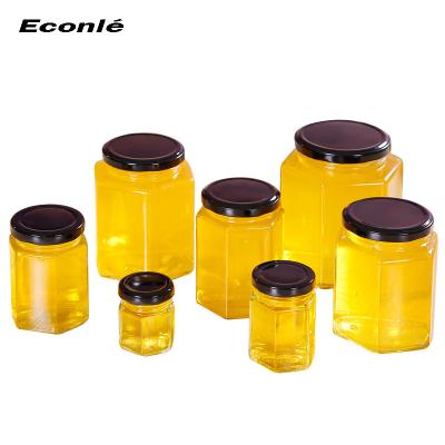 China Different Capacity Honey Wholesale Sale With Lid Hex Honey Glass Jar for sale