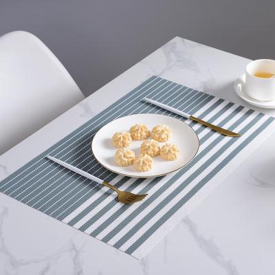 China Durable Colored PVC Table Mats European Design Plate Mat Rectangle Heat Resistant Anti-Slip Waterproof Place Mats for sale