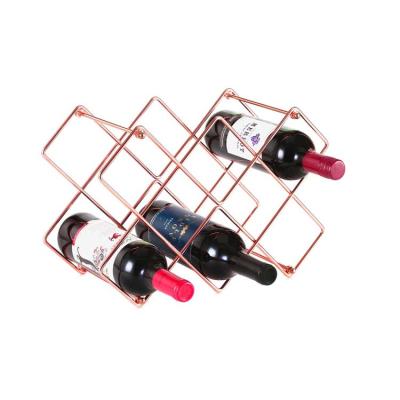 China Modern Countertop Stored Rose Gold Wine Wack Free Standing 10 Bottle Wine Rack For Red White Wine Storage for sale