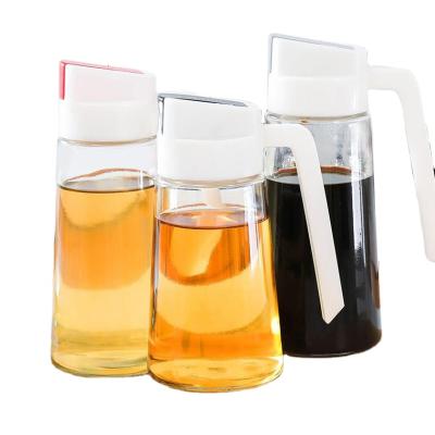 China Sustainable Wholesale Kitchen Cooking Leakproof Oil Dispenser Vinegar Glass Bottle With Automatic Opening Cap for sale