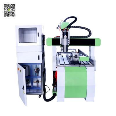 China Hotels ATC CNC Router 6090 4 Axis CNC Router with Servo Motor and Auto Tool Switch Drivers for sale