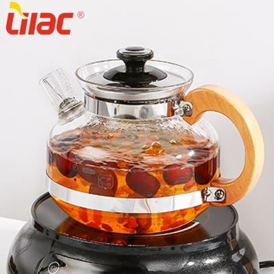 China Free sample lilac viable 1.7L/2.5L boiling teapot theepot wooden handle refined glass teapot with metal frame/wooden handle for sale