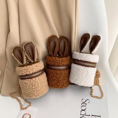 China Fashionable mini lamb hair small cylinder children bag rabbit ears girl envelope earphone cross-body bucket bag for sale