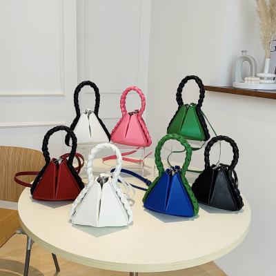 China Fashionable New Spring Petal Twist White Braid Whip Women's Bag Slot Upper Sense Portable Bucket Bag for sale